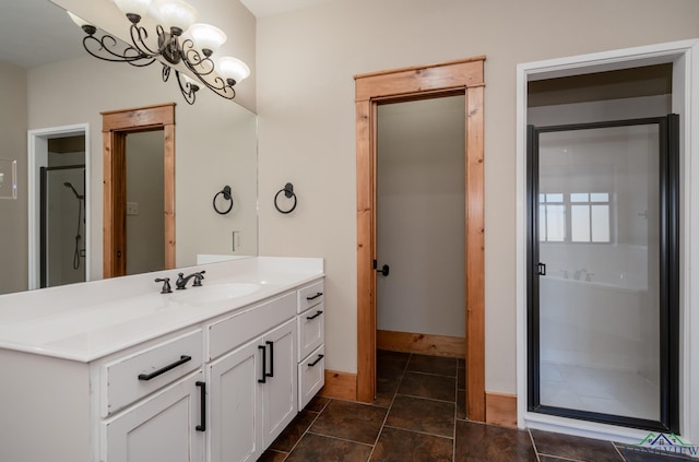 bathroom with vanity and a chandelier