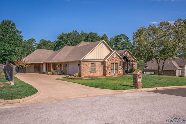 view of front facade with a garage and a front lawn