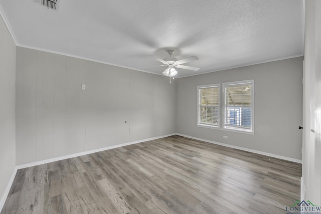 3608 Fm 1970, Carthage, TX 75633 - empty room with ceiling fan, wood finished floors, crown molding, baseboards, and a textured ceiling