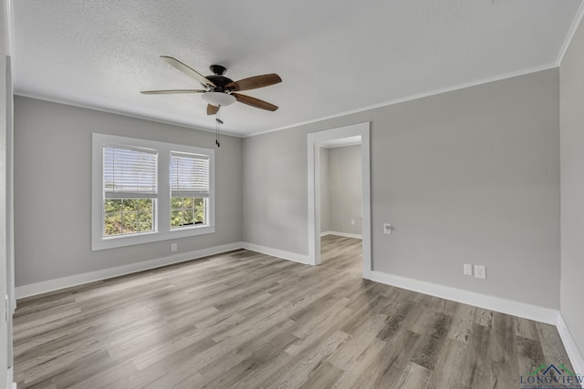 3608 Fm 1970, Carthage, TX 75633 - unfurnished room featuring ceiling fan, baseboards, wood finished floors, and crown molding