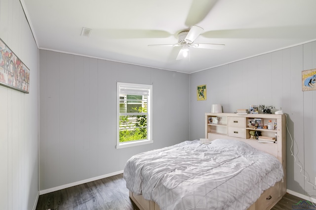 1504 Alice St, Gladewater, TX 75647 - bedroom featuring wood finished floors and ceiling fan