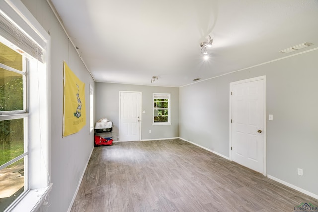 1504 Alice St, Gladewater, TX 75647 - unfurnished room with wood finished floors and baseboards