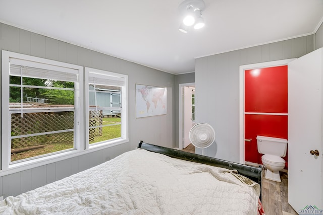 1504 Alice St, Gladewater, TX 75647 - bedroom featuring wood finished floors, multiple windows, and ornamental molding