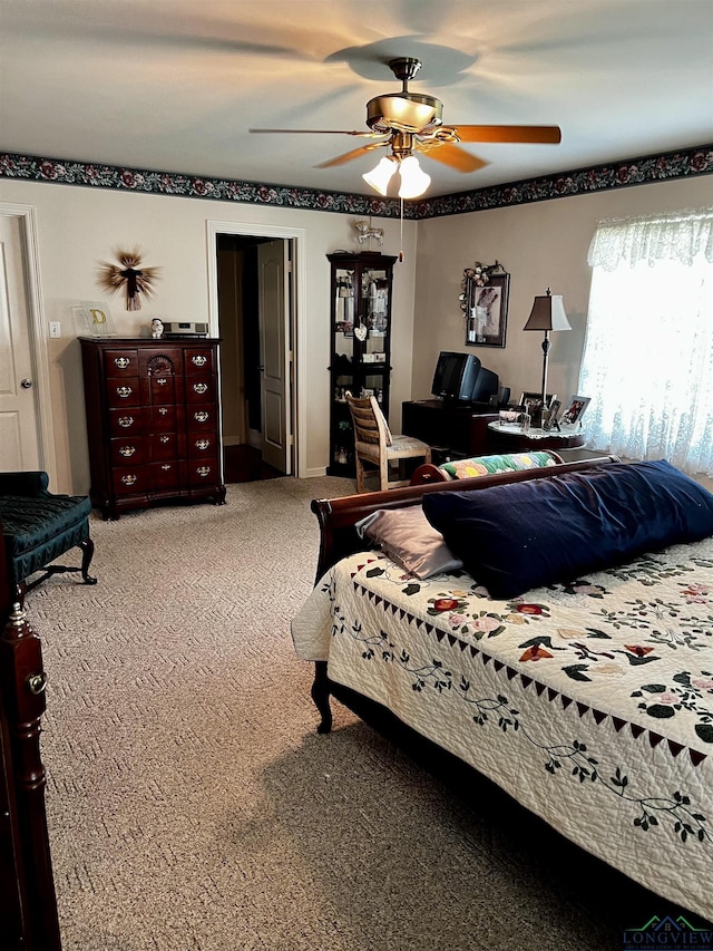 carpeted bedroom featuring ceiling fan