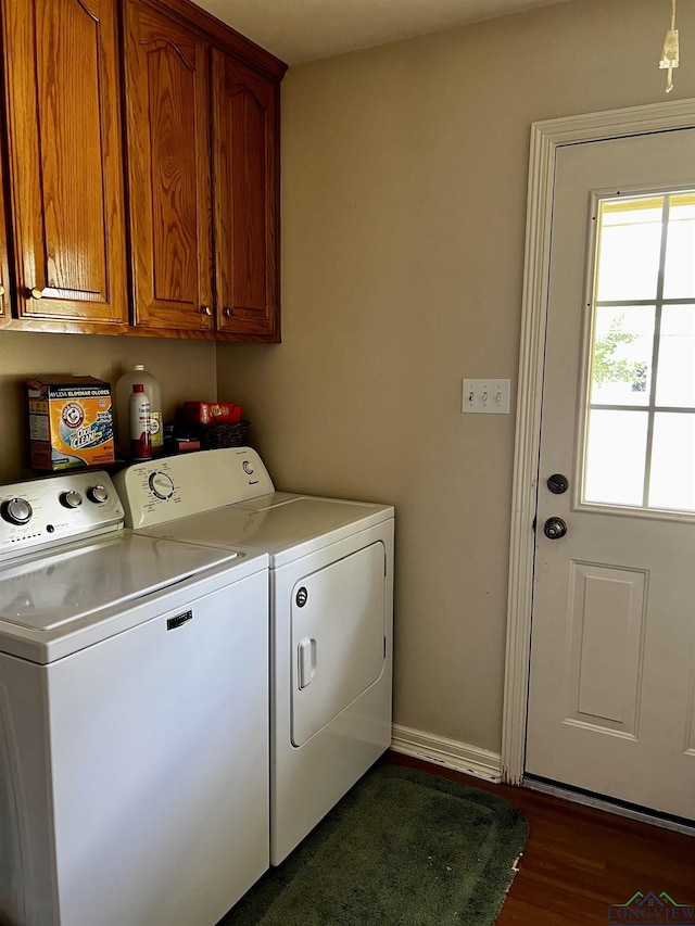 washroom with cabinets, dark hardwood / wood-style floors, and independent washer and dryer