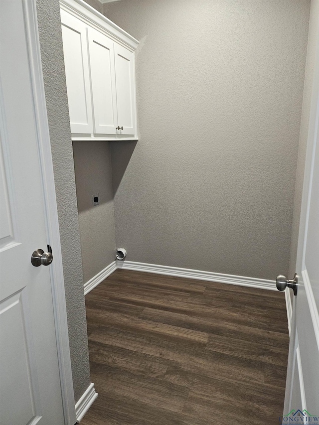 washroom with dark hardwood / wood-style floors and hookup for an electric dryer