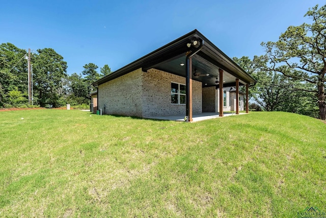 exterior space featuring a patio area and ceiling fan