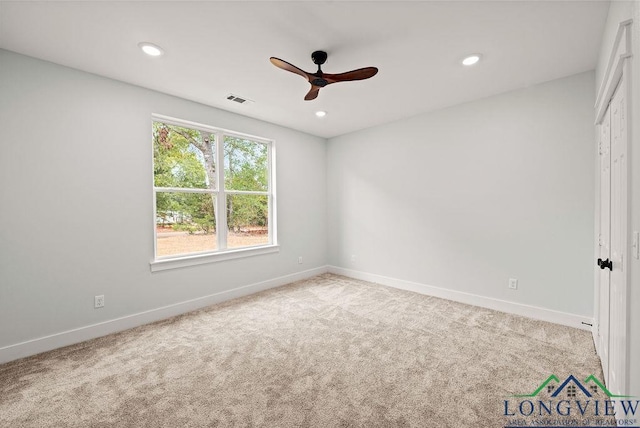 carpeted empty room with ceiling fan