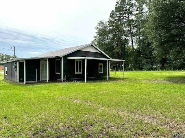 back of house featuring a yard