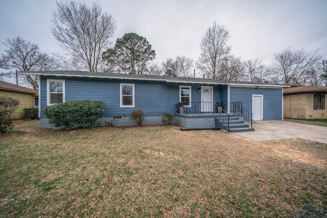 ranch-style home featuring a front lawn, crawl space, and concrete driveway