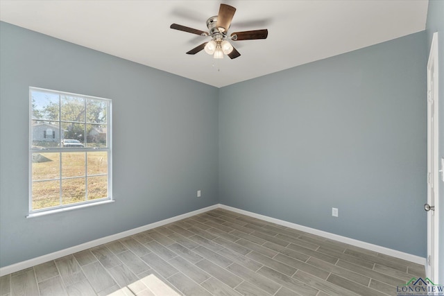 unfurnished room with hardwood / wood-style flooring, plenty of natural light, and ceiling fan