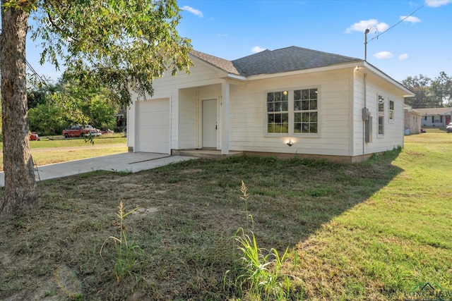 single story home with a garage and a front lawn