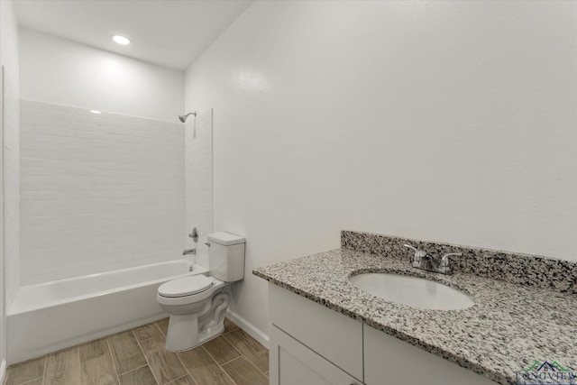 full bathroom with vanity, toilet, and tiled shower / bath combo