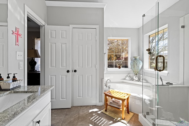 bathroom with shower with separate bathtub and vanity