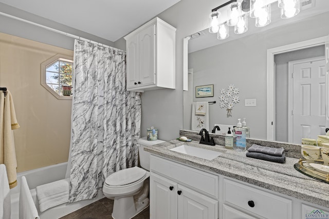 full bathroom featuring shower / tub combo with curtain, vanity, and toilet