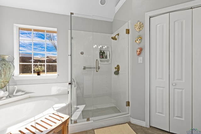 bathroom with a shower with door