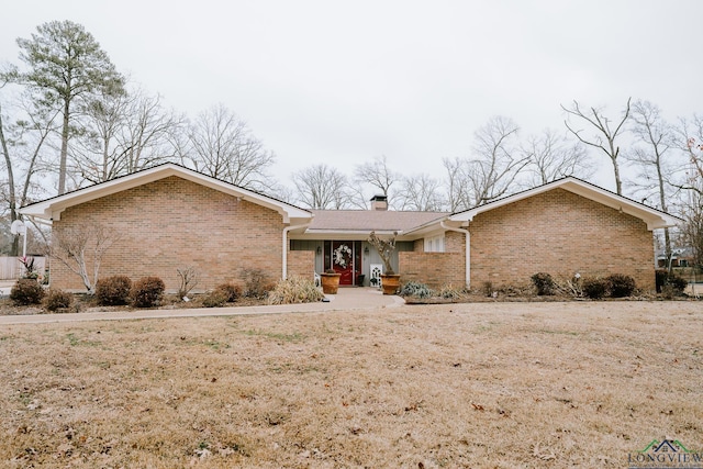 ranch-style house with a front yard