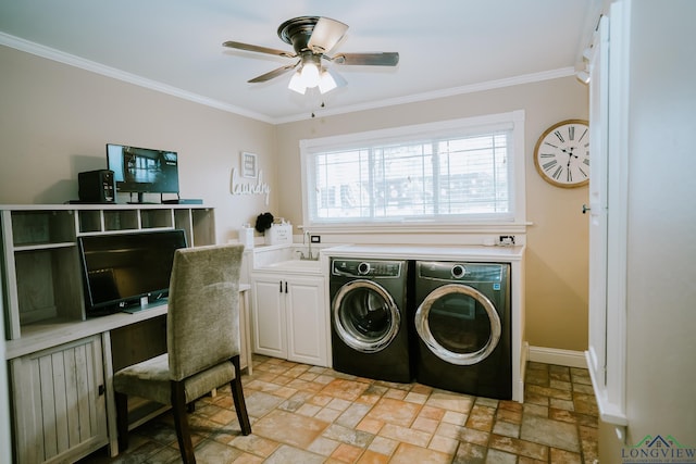 washroom featuring cabinets, washing machine and dryer, sink, and crown molding