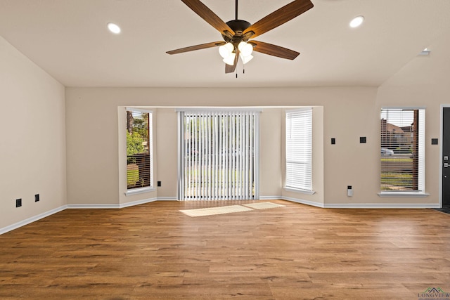 spare room with recessed lighting, light wood-style floors, baseboards, and ceiling fan