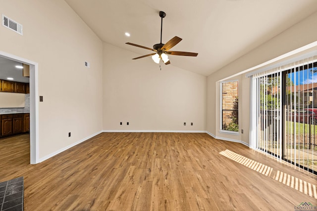 unfurnished room with light wood-style floors, baseboards, a ceiling fan, and visible vents