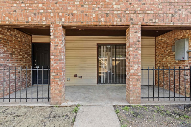 entrance to property with brick siding