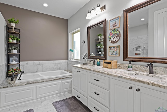 bathroom featuring a bathtub and vanity