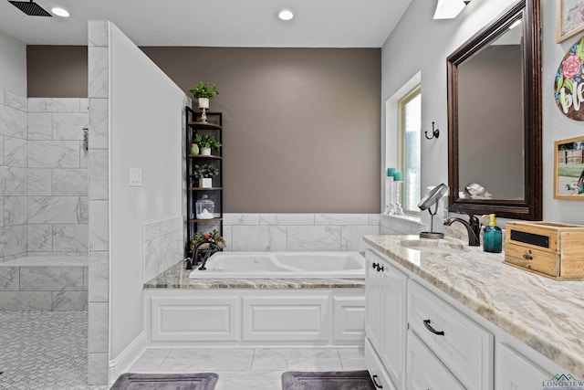 bathroom with separate shower and tub and vanity