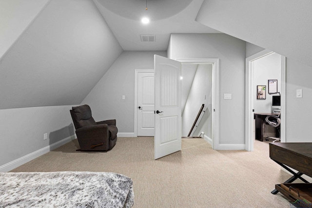 bedroom with carpet and lofted ceiling