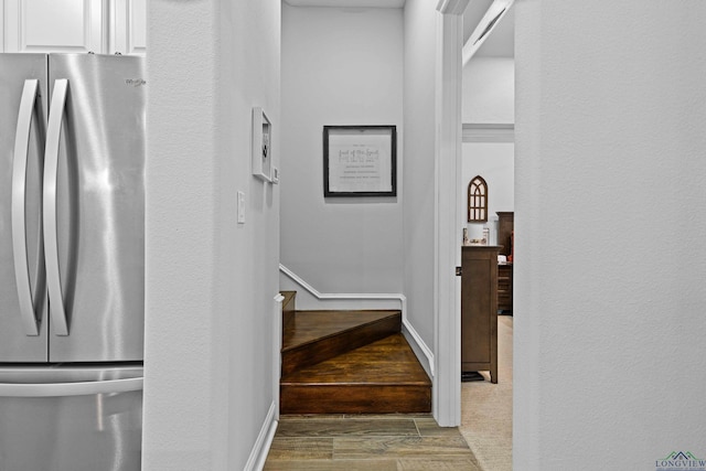 stairs with hardwood / wood-style flooring