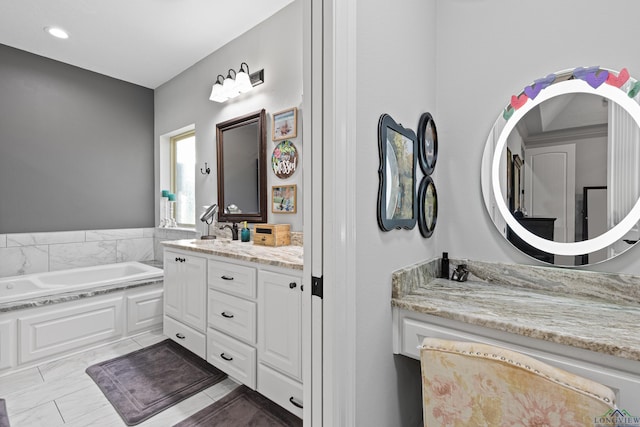 bathroom featuring vanity and a bathing tub