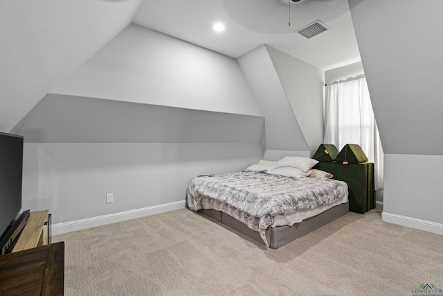 carpeted bedroom with lofted ceiling and ceiling fan