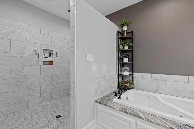 bathroom with shower with separate bathtub