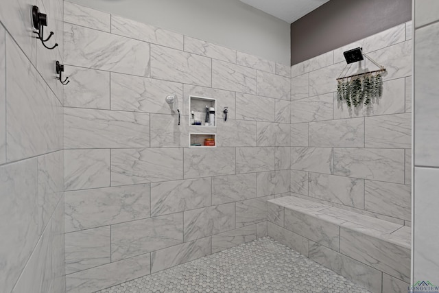 bathroom featuring tiled shower