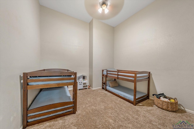 280 S Stonewall St, Tatum, TX 75691 - carpeted bedroom with baseboards, vaulted ceiling, and a ceiling fan