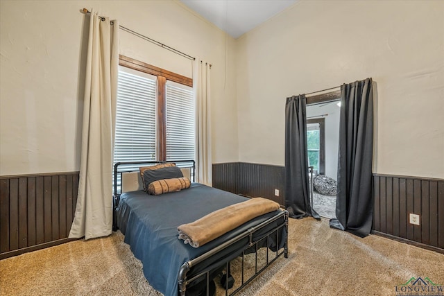 280 S Stonewall St, Tatum, TX 75691 - bedroom featuring a wainscoted wall, carpet flooring, and wooden walls