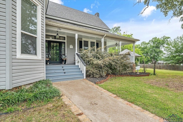280 S Stonewall St, Tatum, TX 75691 - doorway to property featuring a porch and roof with shingles