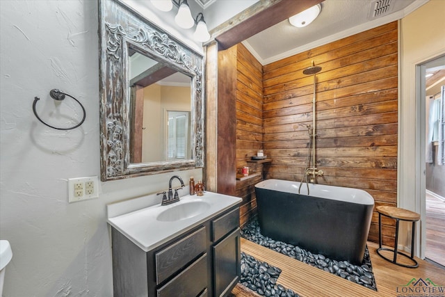 280 S Stonewall St, Tatum, TX 75691 - full bath featuring a soaking tub, vanity, wooden walls, crown molding, and wood finished floors