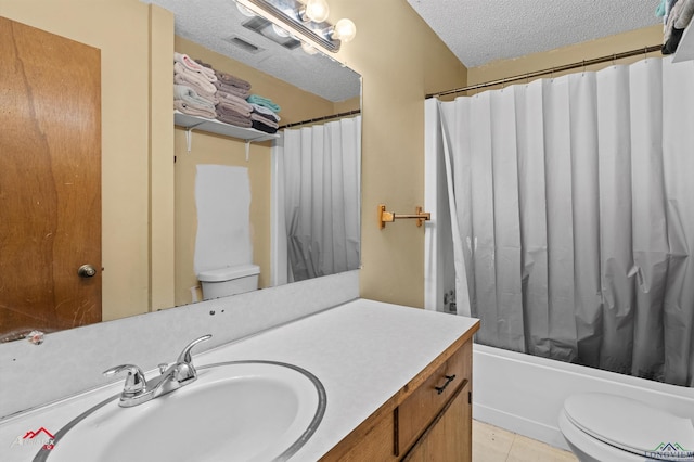 711 Comer St, Carthage, TX 75633 - full bathroom with toilet, vanity, a textured ceiling, tile patterned floors, and shower / bath combo
