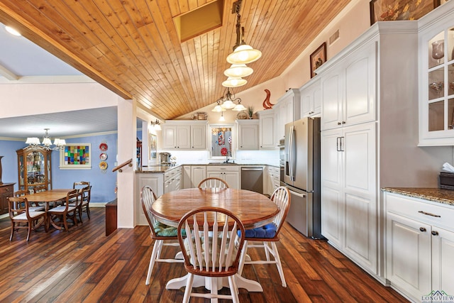 dining room featuring dark hardwood / wood-style flooring, an inviting chandelier, crown molding, and wooden ceiling