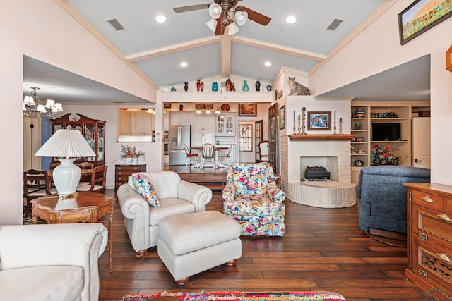 living room with ceiling fan with notable chandelier, lofted ceiling with beams, dark hardwood / wood-style floors, and a fireplace