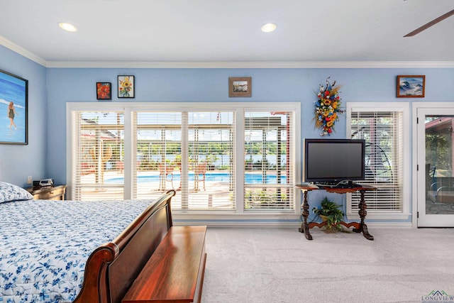 bedroom with carpet flooring, multiple windows, and crown molding