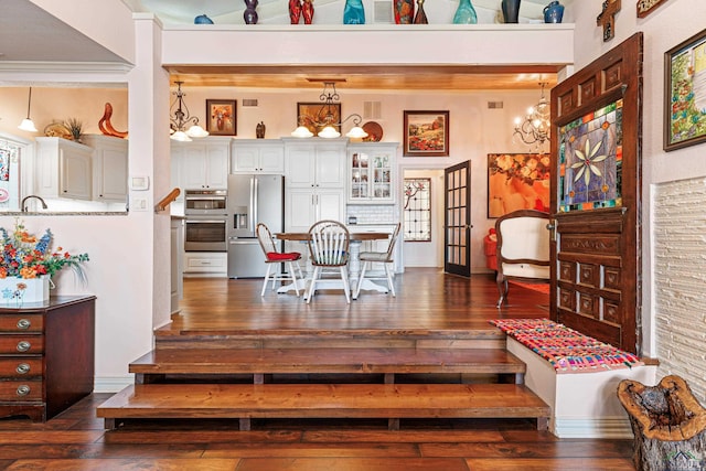 interior space featuring dark hardwood / wood-style flooring and ornamental molding