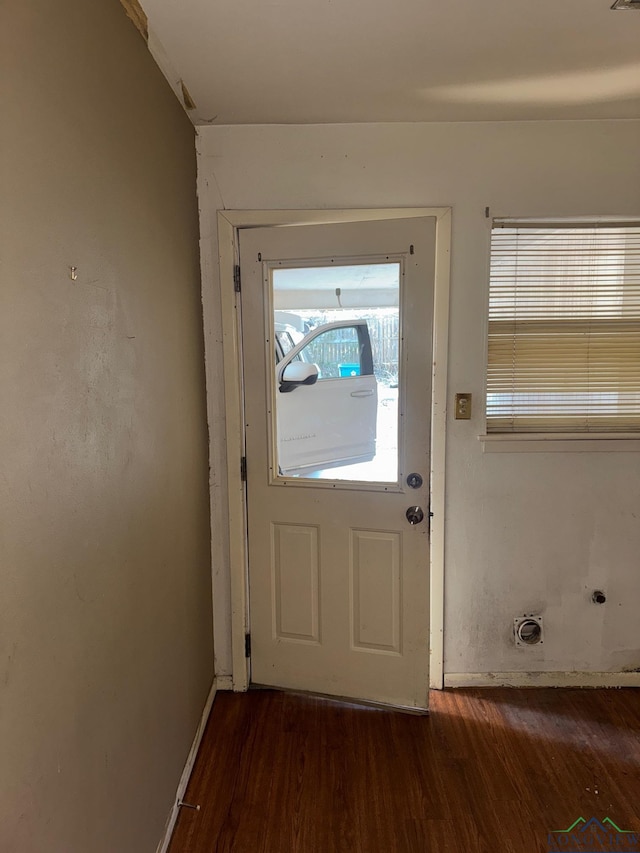 doorway to outside with dark hardwood / wood-style floors