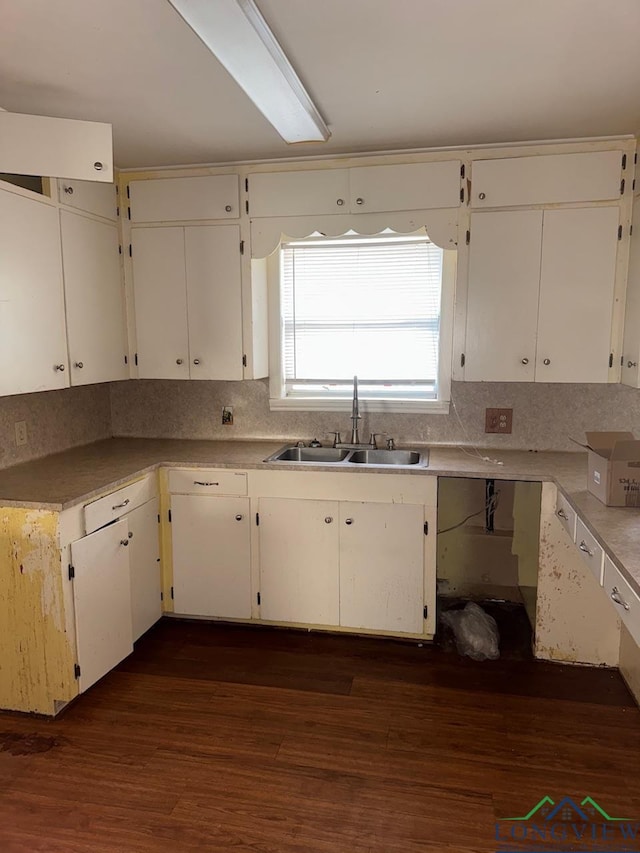 kitchen with white cabinets, backsplash, dark hardwood / wood-style flooring, and sink