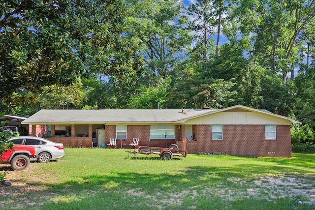 ranch-style house featuring a front lawn