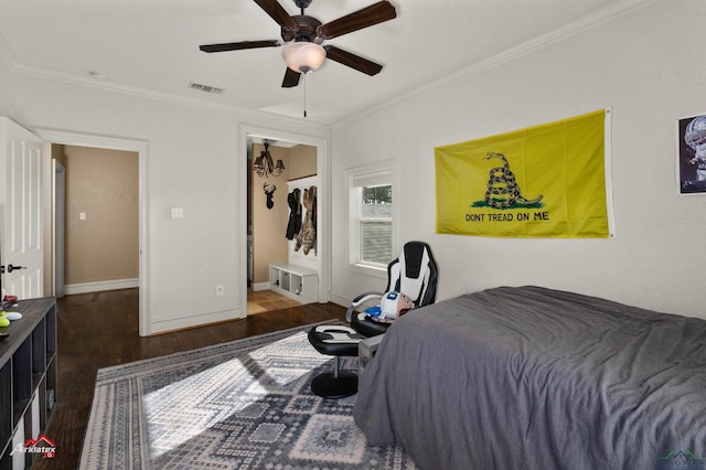 bedroom featuring ceiling fan, dark hardwood / wood-style flooring, and ornamental molding