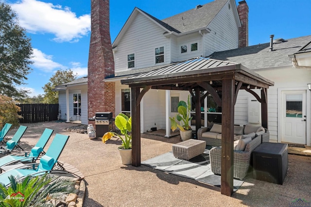 view of patio / terrace with outdoor lounge area, a gazebo, and a grill