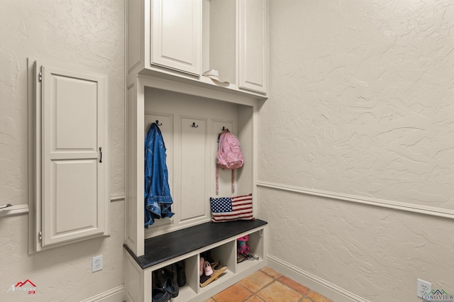 mudroom with light tile patterned flooring