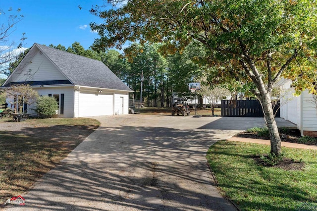 exterior space featuring a garage and an outdoor structure