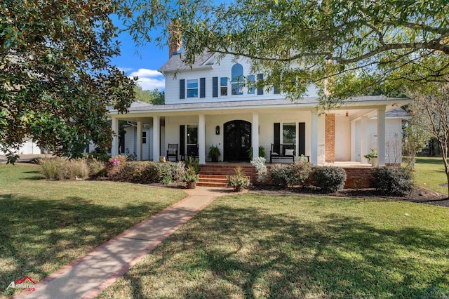 view of front facade with a porch and a front yard